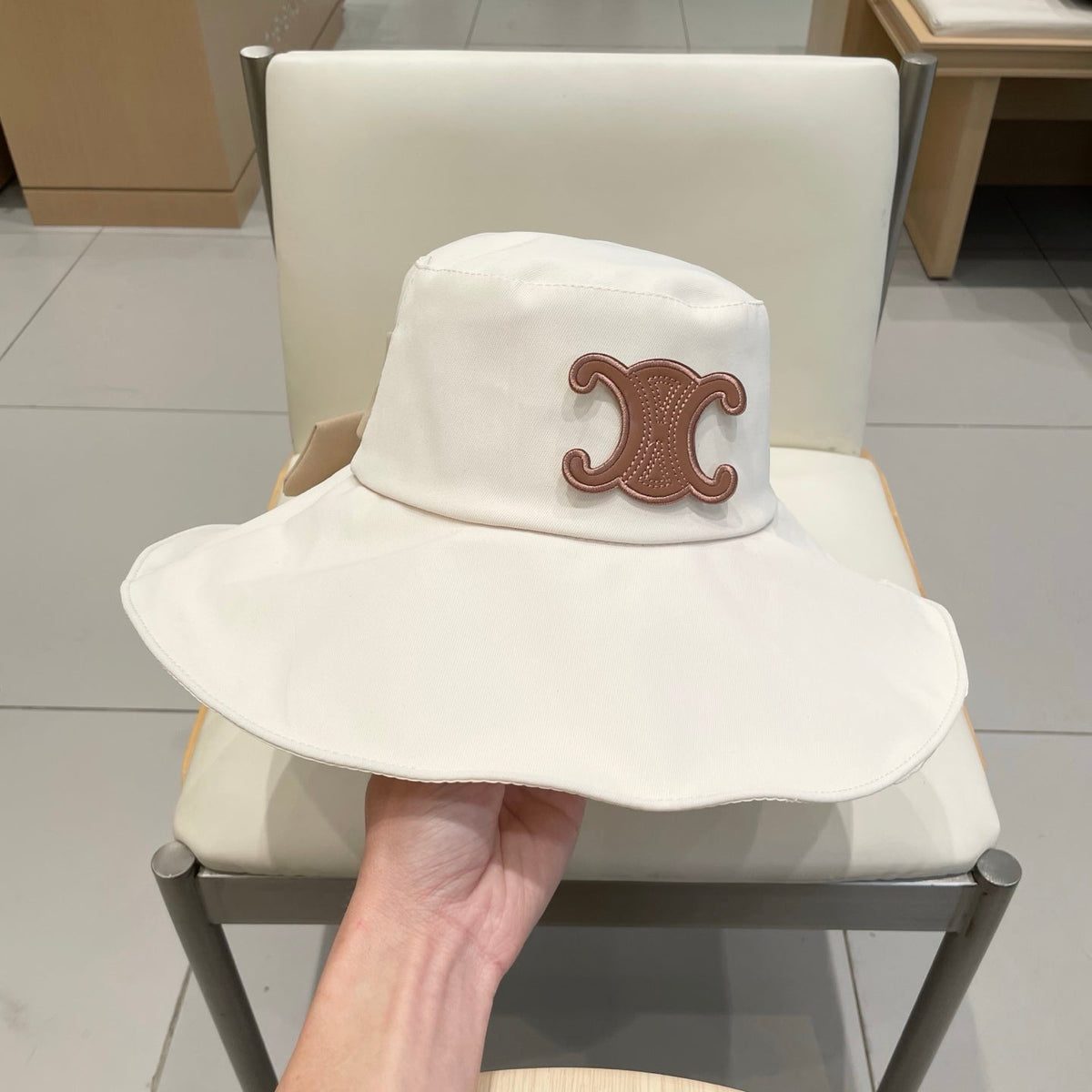 CELINE 25S BUCKET HAT 735013 IN IVORY